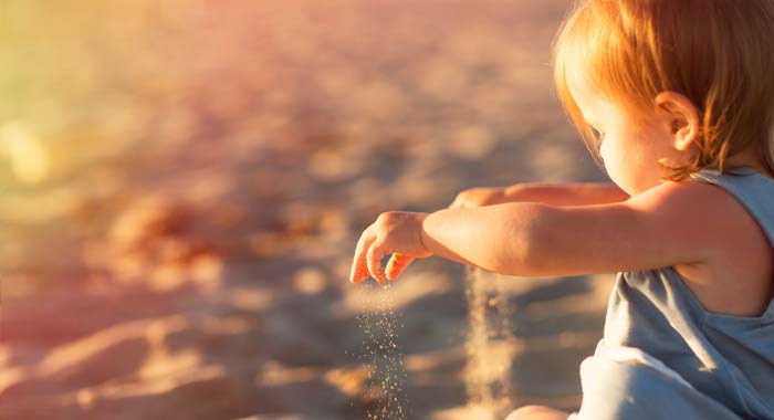 Girl on the beach at sunset